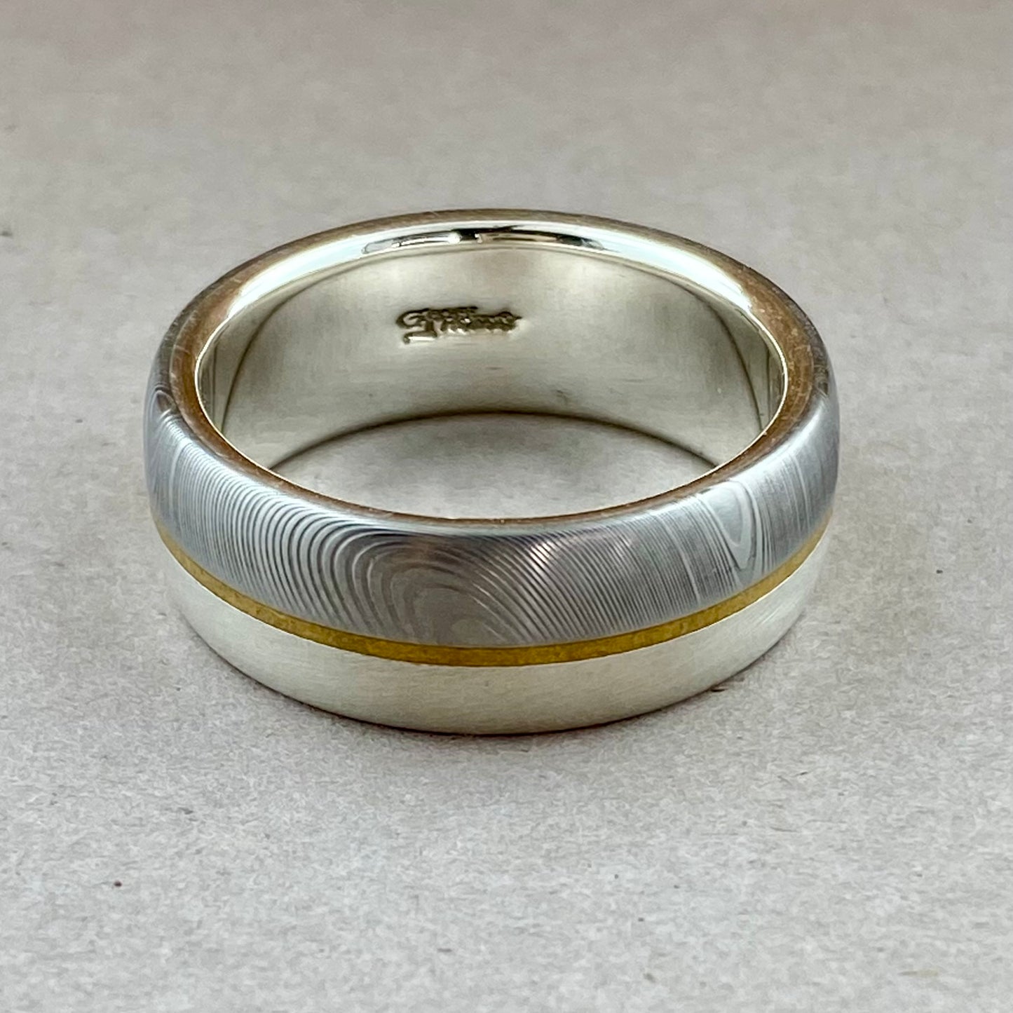 Damascus band on Sterling w Brass Strip sz12